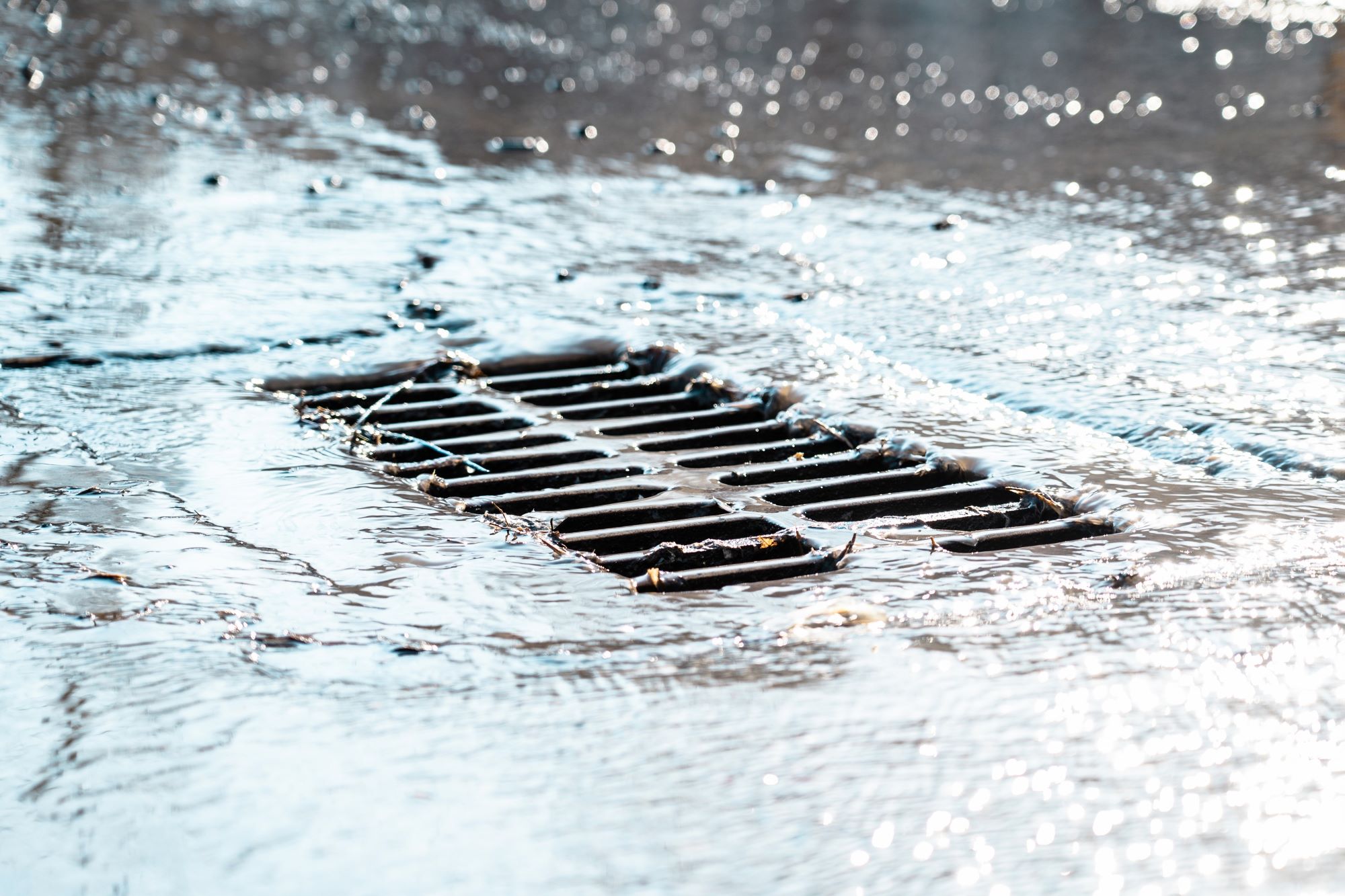 Stormwater flowing down a street drain 