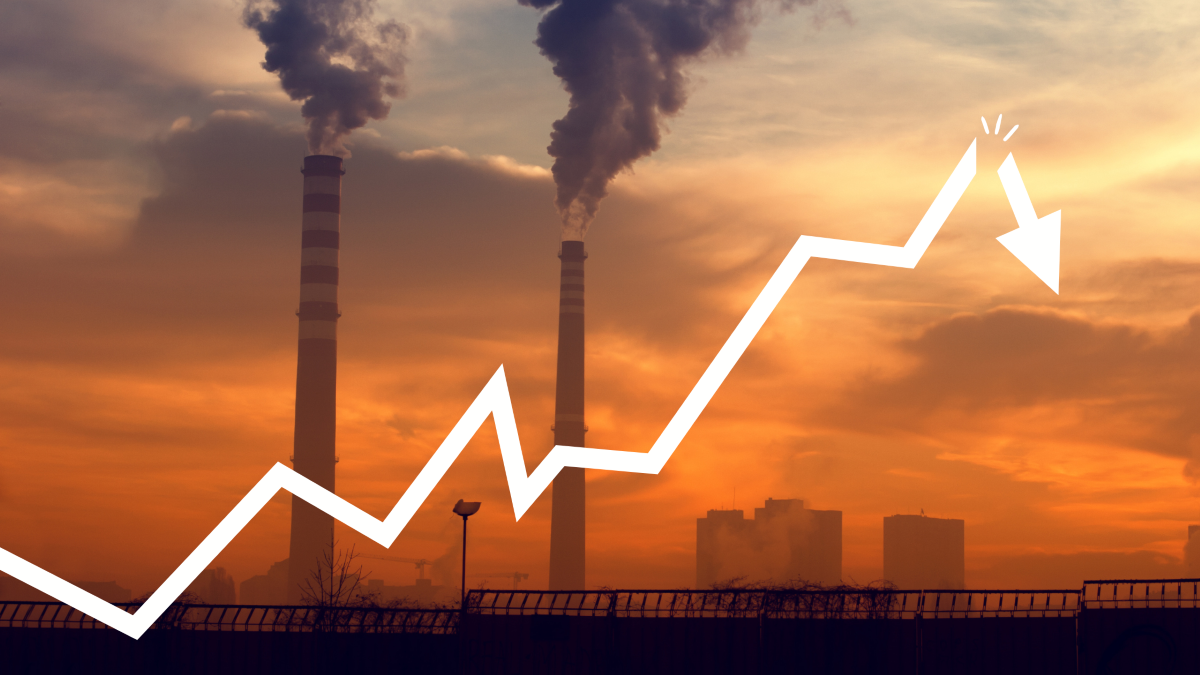 Upward line graph with smokestack image in background