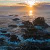 Rocky islands in the sea with sunset